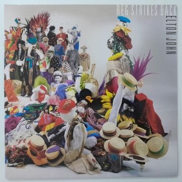 Elton John ‎– Reg Strikes Back