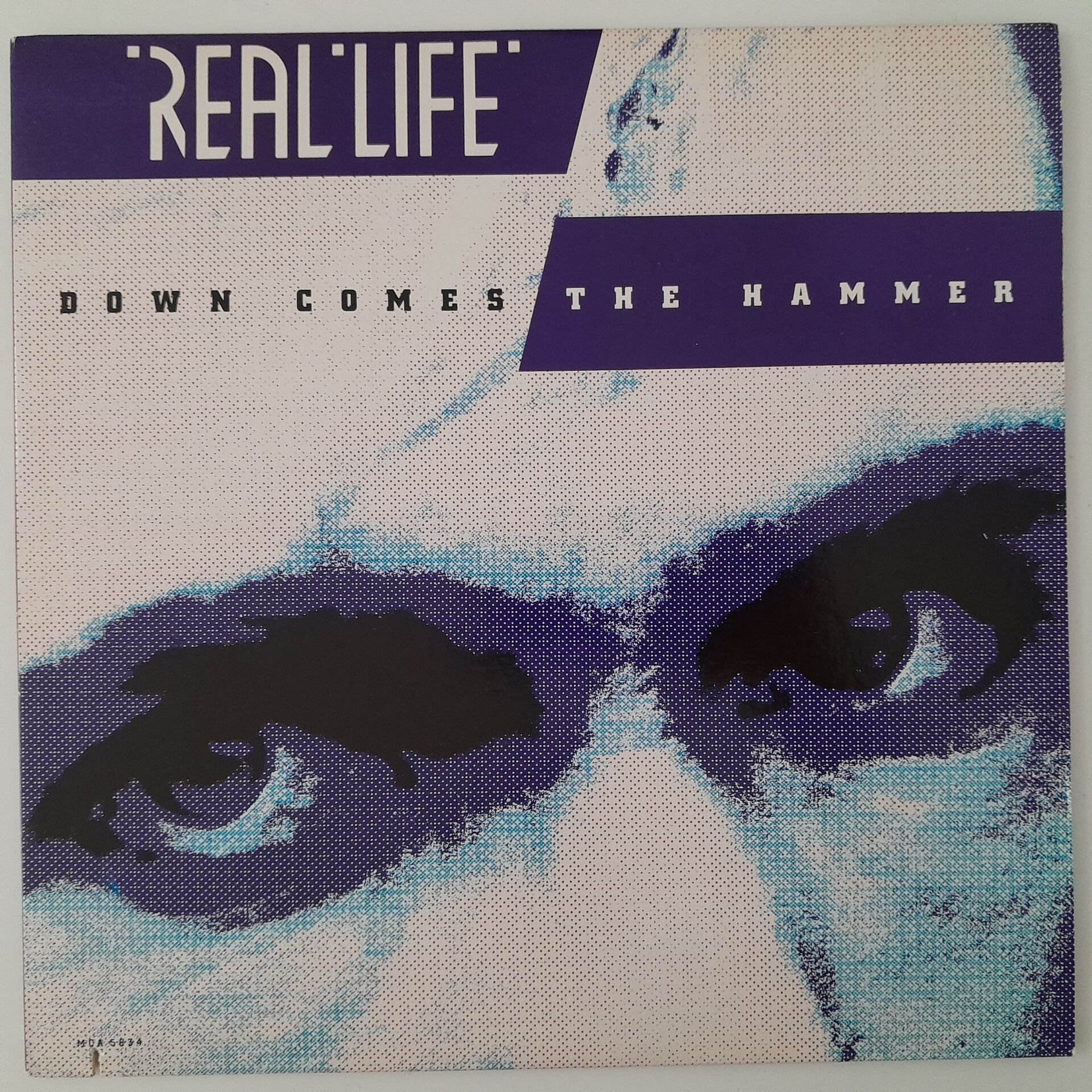 Real Life – Down Comes The Hammer