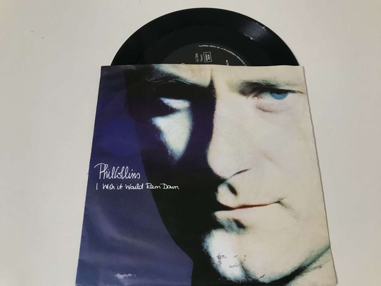 Phil Collins – I Wish It Would Rain Down